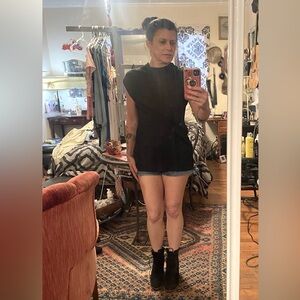 Black mock neck somewhat open weave, (but not see through) sweater. Size sm